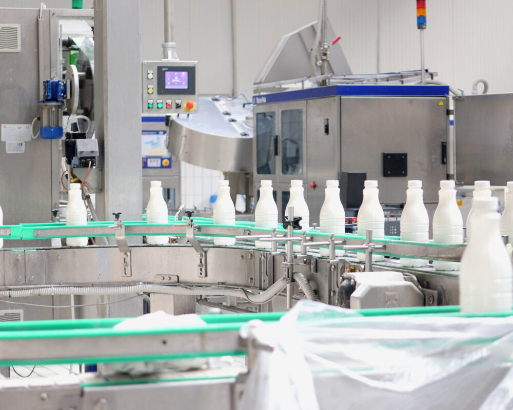 DETERGENT INDUSTRY  Home 10 footage of milk bottles at the production line in a milk company SBI 351052448 scaled 1000x800