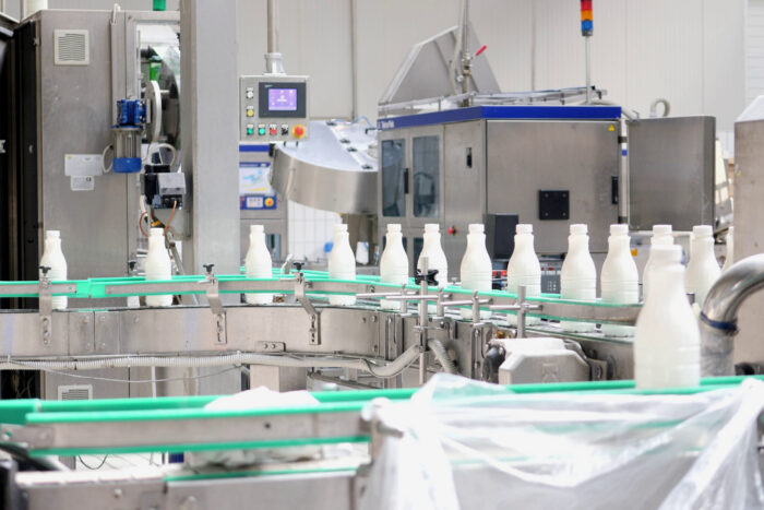 DETERGENT INDUSTRY  Services footage of milk bottles at the production line in a milk company SBI 351052448 scaled 700x467