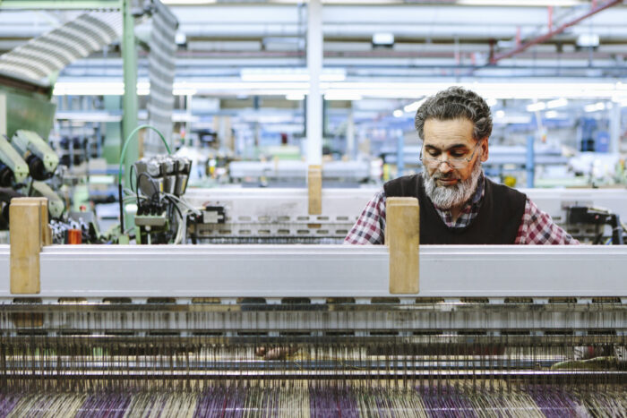 Male factory worker on weaving machine in woollen mill  Services male factory worker on weaving machine in woollen 2025 04 05 06 53 11 utc 1 scaled 700x467